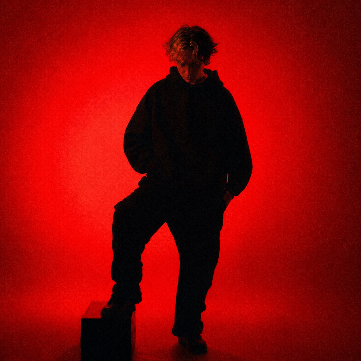 Inverge artist portrait against a vivid red light